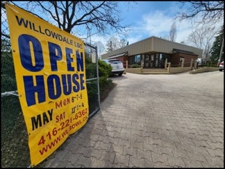 Open house banner with Willowdale Lawn Bowling clubhouse in background.